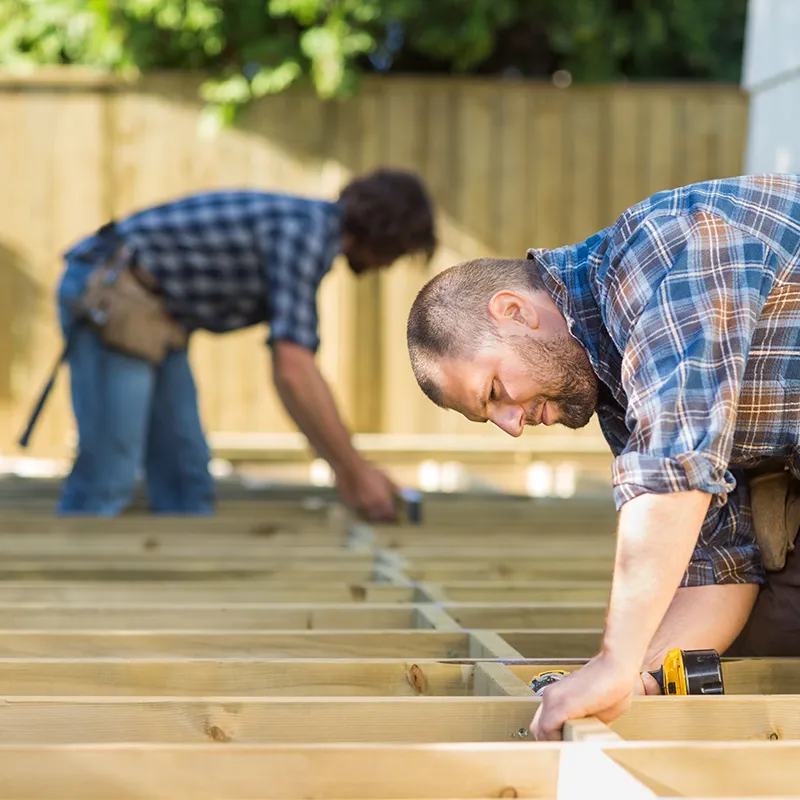 2 Workers Building a New Deck Outside | In and Out Flooring