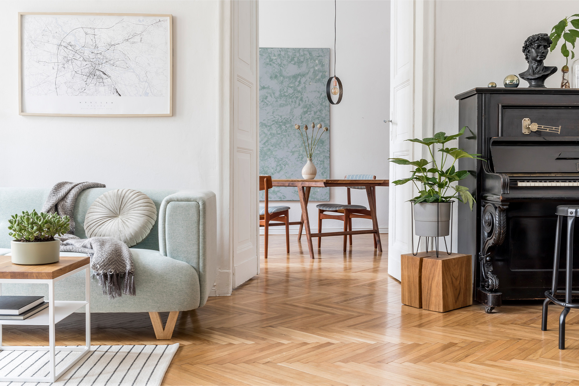 Herringbone hardwood flooring in a bright living room with modern decor